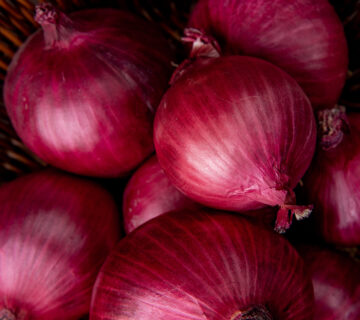 Close up view basket red onions 1 360x320